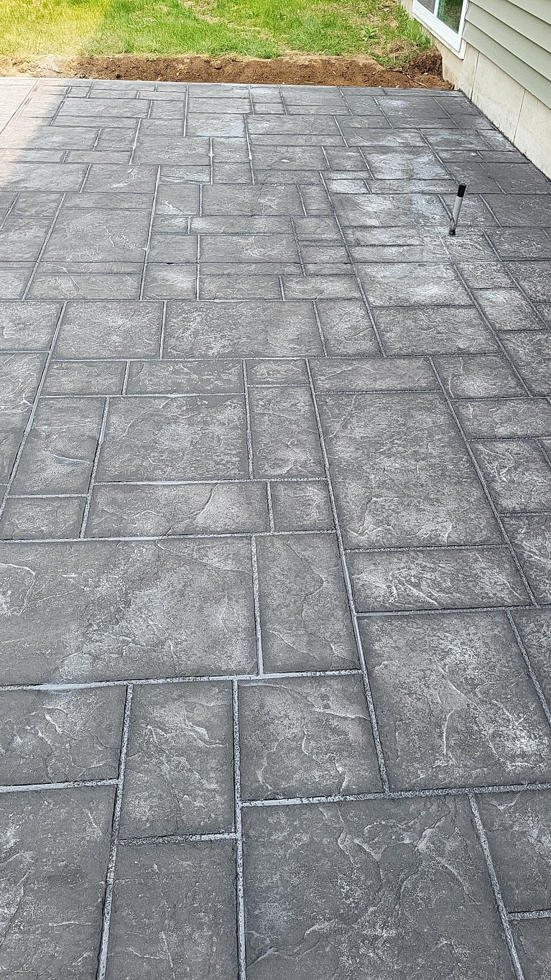 Stamped concrete patio with large stone pattern by RK Masonry Services in Marathon County, WI