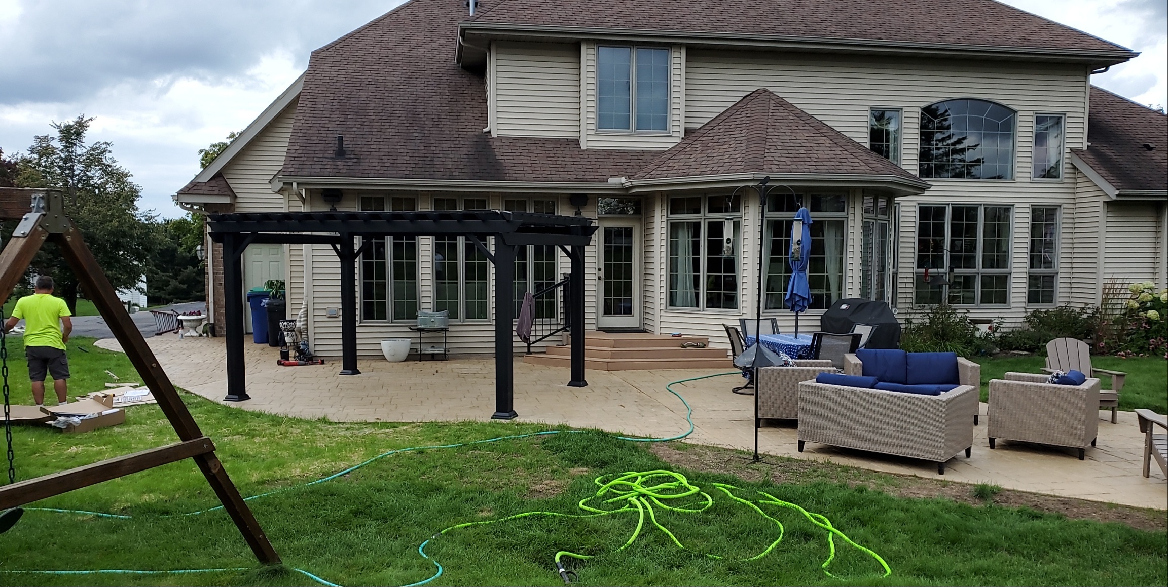 Finished concrete patio with pergola installed by RK Masonry Services in Weston, WI