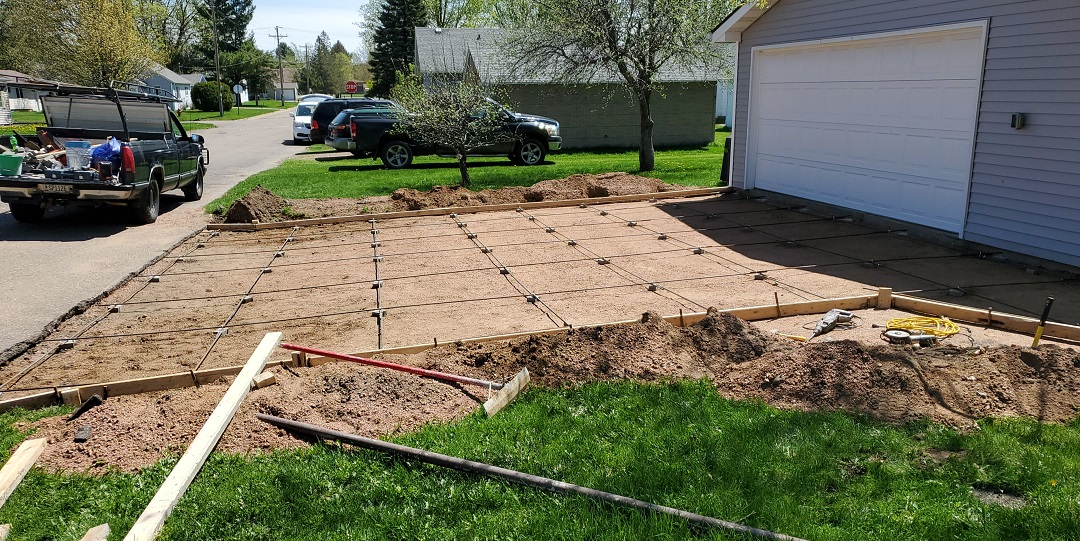 Damaged concrete driveway needing replacement in Wausau, WI